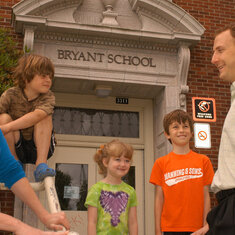 Scott talking with parents in front of Bryant School.