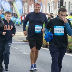 Matthew helps Sean over the line in the Dublin Marathon.