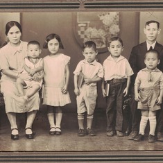 Seiyei (middle) and family