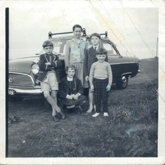 Charles's five children stand next to his old Ford Consul which we all used to pile into, the record stood at 11 people!