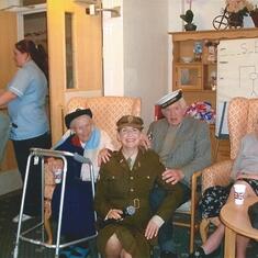 This photo is in Picton Court Nursing Home, Porthcawl. Beatrice was here for 6 months. They are photographed with a Vera Lynn impressionist who goes around the homes singing the old time favourites.