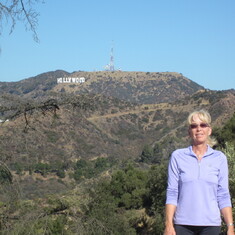 Sharon on a hike in front of the Hollywood sign in Los Angeles