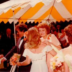 Mom "Wanda" hugging the bride
