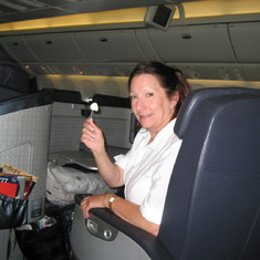 Flying First Class on a 777 with Sharron on one of our many, many trips around the globe.