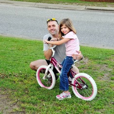 The day he taught Kenna to ride her bike with no training wheels. She chose this photo to wear in her sweet little silver locket.