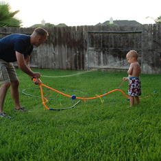The Campbells visited the Griffins, summer 2008. Backyard sprinklers were a must - for kids and adults.
