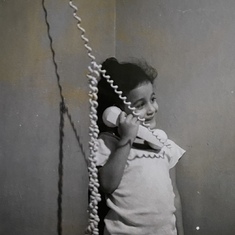 Sheree on the phone as a young girl 