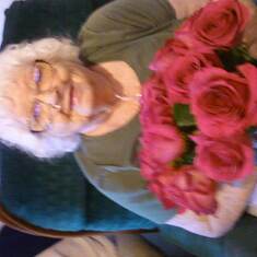 My beautiful mother on her special day! The flowers I sent her cause I love her so much.