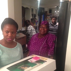 Ibukun presenting birthday cake to Shirley Awofeso at Oriaran residence in Appleton 