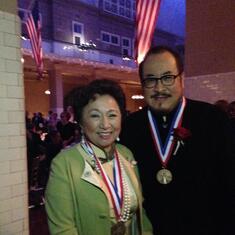 Shirley and Tian, both recipients of the Ellis Island Medal of Honor in 2013