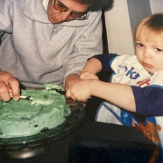 Helping Oma frost her birthday cake