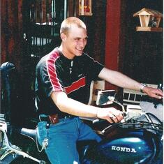 Travis enjoyed his motorcycle while on leave 2000 .