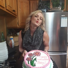 Stacey on her graduation day, enjoying cake