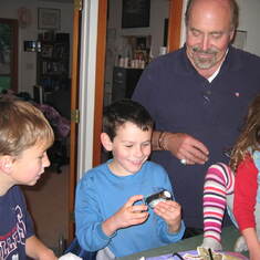 Stan with his grandkids, Jacob and Lucy (and Trevor Beall) at Jacob's birthday party.