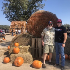 Mark and Stan, on a pumpkin patch trip in 2022 Lucy convinced them to attend. 