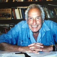 Stan at his desk in his home office.