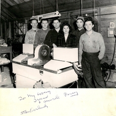 1946 - Stan (3rd from left) and his crew in the original barn at Exchange Auto Parts with his newly invented Benjamin Automatic.  ~ This photograph is from the personal collection of family treasures kept by Barney's wife, Frances Baranoff (now Friedman).