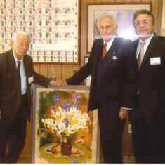Dr. Tadashi Sasaki, Dr. Zvi Yaniv visiting Stan after Iris passed away. We presented to Stan a symbolic painting showing an iris that fell on the table from the bouquet of flowers in the vase