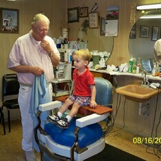 My son getting his first hair cut.