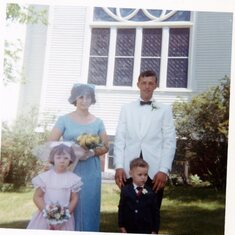 Stan as a young boy as a ring bearer in my Aunt's wedding with his parents and older sister.