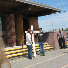 Kass and Dan holding his cross