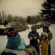 Steph, John Steven and Michael snowmobiling