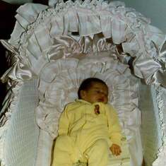Stephanie in her bassinet