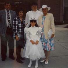 Stephanie with her daddy, grandma and aunt Jennie, who made the dress