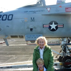 Proud Mom standing in front of Stephen's plane on the USS Carl Vinson with Declan