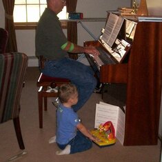 Stephen and his grandson playing the piano.