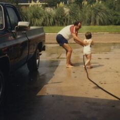 Washing the truck with his son