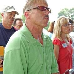 Steve "in the moment" singing at The We Together picnic with brother Doug in the background
