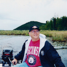 Steve at the tiller on the fishing trip to Canada