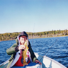 Steve with a walleye he caught on Lake Zinzania in Canada. 