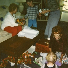 Great Grandma Piggott, Tyler, Grandma Sue and Tona in the foreground celebrating Christmas