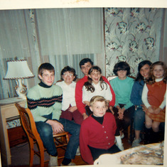 Sue Ann ( glasses) with siblings, cousins & neighbors