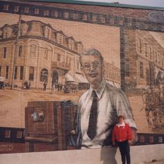 Mom in Midland in front of Dan Dan's mural. 