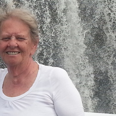 Mom in front of a waterfall in Ottawa.