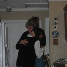 Me and mom sneaking a hug in while making Thanksgiving Dinner - 2008