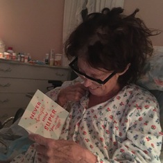 2021 Feb 12 (a week before passing, reading retirement cards from her hospice bed; she retired on January 22)