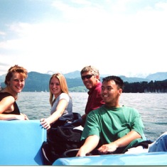 My sisters Stacy and Carolyn in a boat in Switzerland with Monsieur et Madame Saddler.