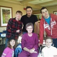 Sylvia surrounded by some of her grandkids