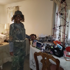 Mother in Army outfit waiting on grands