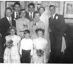 Tanya (in front of her dad) as bridesmaid at her  big brothers wedding
