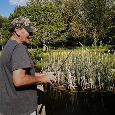 Terry fishing in his pond