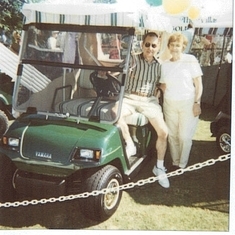 Mom and Dad buying their golf cart after moving to the Villages in 2001.