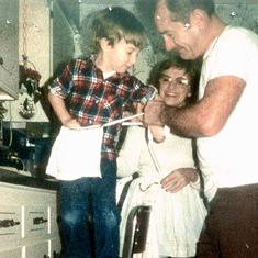 Me (Kevin) at 4 1/2 years old getting dressed to bake Christmas cookies with Ma & Pa. 1986.