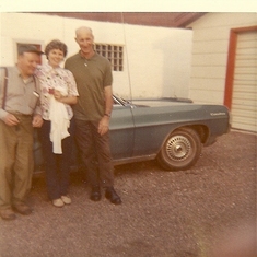 Grandpa Casper, Mom and Dad and hot looking Pontiac.