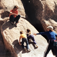 Theresa teaching her grandkids how to climb (Justin, Christopher and Tiffany)