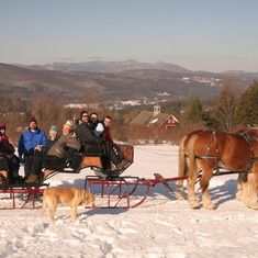 Family sleigh ride in Vermont